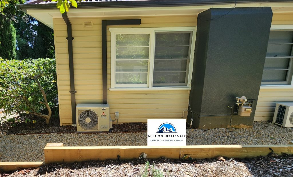 A house with an installed outdoor unit of AC
