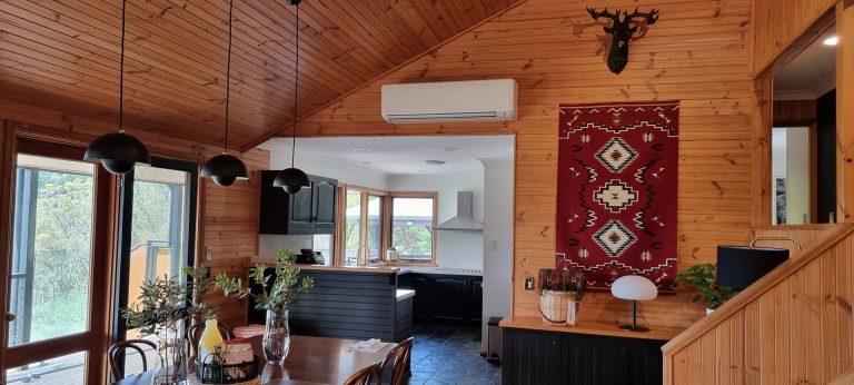 A cozy living room with an air conditioning installed